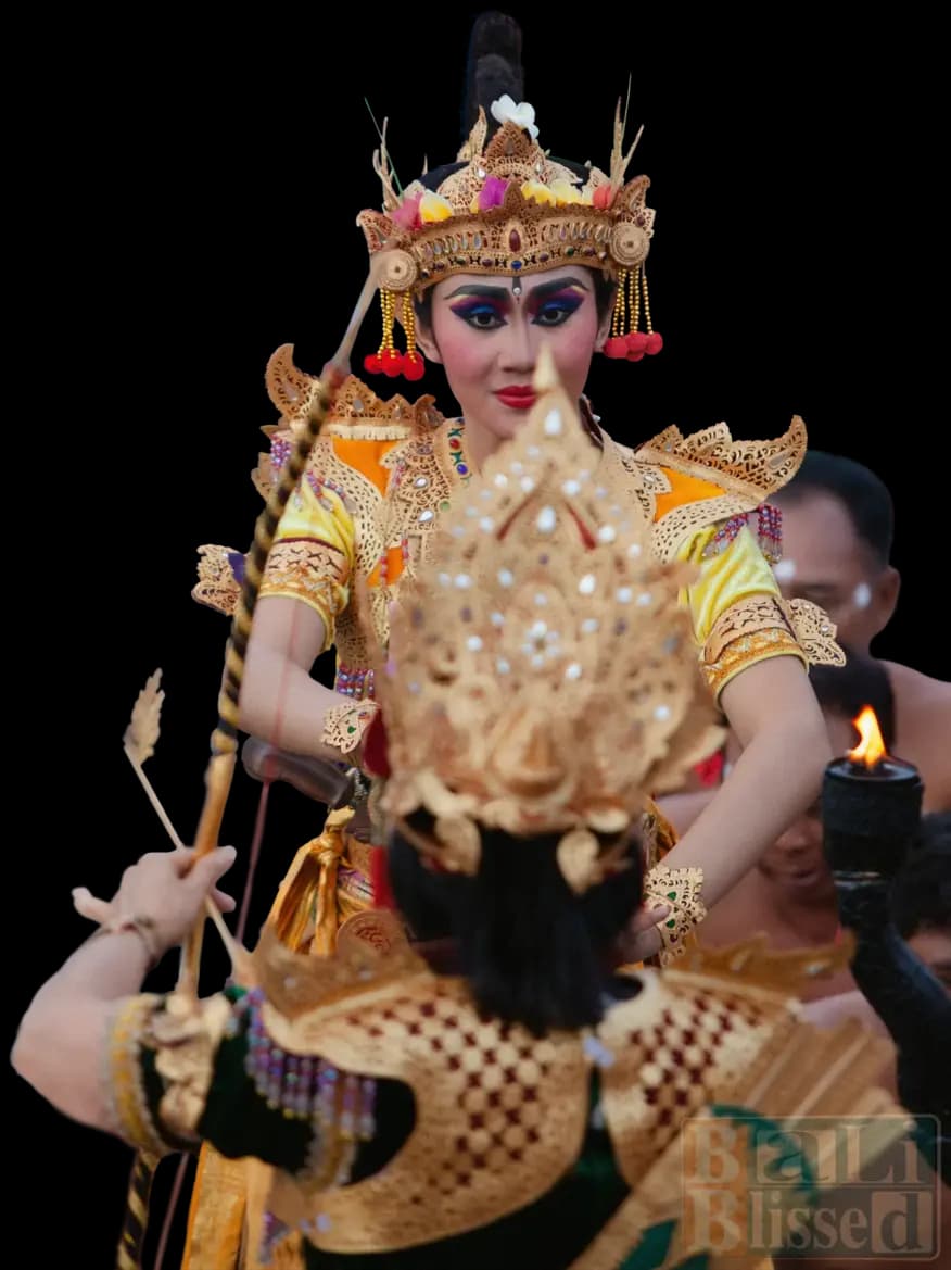 Traditional Balinese Kecak Dance performance at Uluwatu Temple during sunset